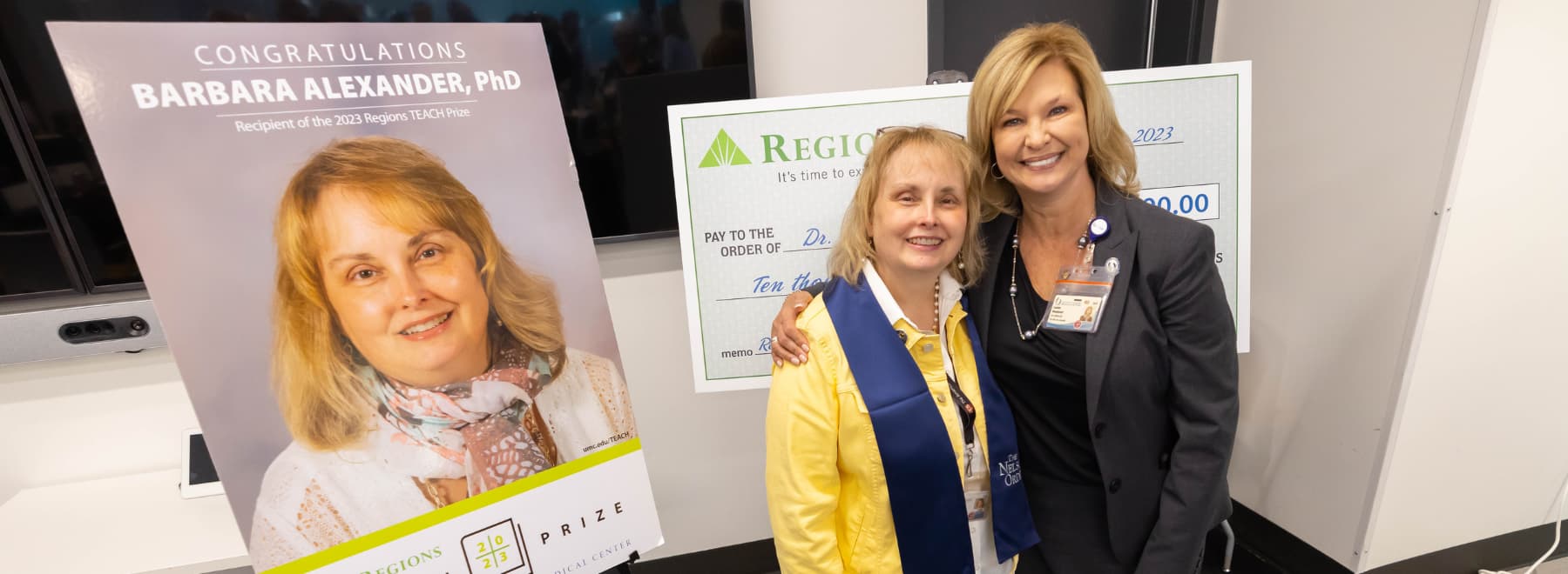 Regions TEACH Prize honoree Dr. Barbara Alexander, professor of physiology and biophysics, left, receives congratulations from Dr. LouAnn Woodward, vice chancellor for health affairs and dean of the School of Medicine.